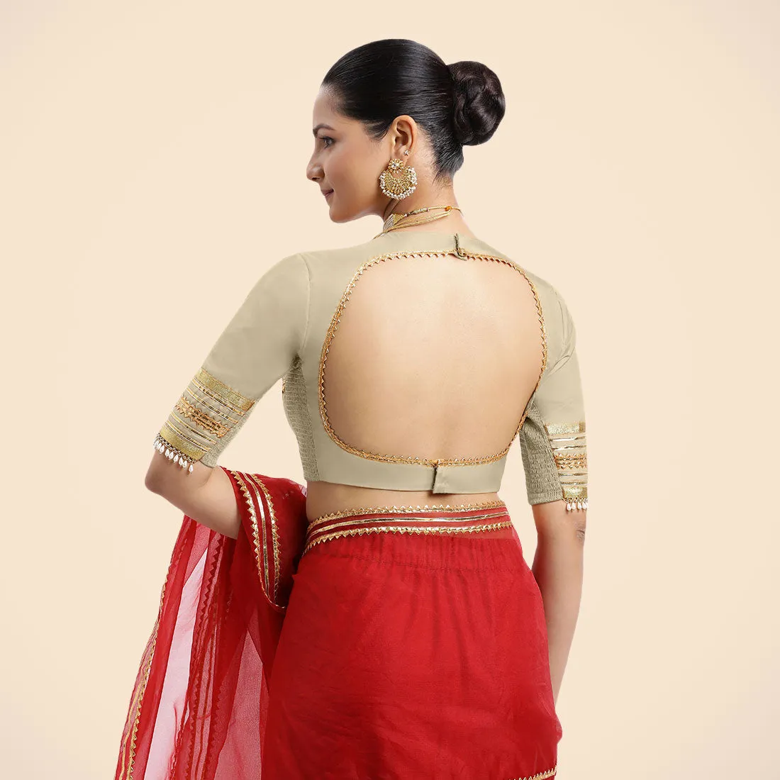 Farheen x Tyohaar | Cream Embellished Elbow Sleeves FlexiFit™ Saree Blouse with Zero Neck with Back Cut-Out and Golden Gota Embellishment